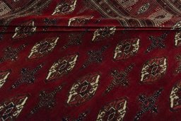 Full view of 2000s Baloch rug from Iran / Persia, 392 × 290 cm in Red tones