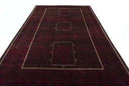 Surface texture of 2000s Baloch rug with natural Wool and intricate pattern