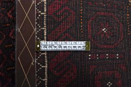 Close-up detail of 2000s Baloch rug from Iran / Persia showing Wool weave