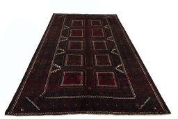 Surface texture of 2000s Baloch rug with natural Wool and intricate pattern