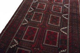 Backside of handmade 2000s Baloch rug showing knot structure and weave density