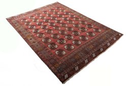 Corner detail of 2000s Baloch rug showing border pattern and Wool pile