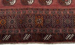 Surface texture of 2000s Baloch rug with natural Wool and intricate pattern