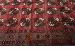 Backside of handmade 2000s Baloch rug showing knot structure and weave density