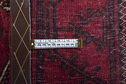 Close-up detail of 2000s Baloch rug from Iran / Persia showing Wool weave