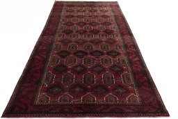 Surface texture of 2000s Baloch rug with natural Wool and intricate pattern