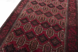Backside of handmade 2000s Baloch rug showing knot structure and weave density