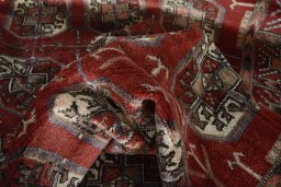 Corner detail of 2000s Baloch rug showing border pattern and Wool pile