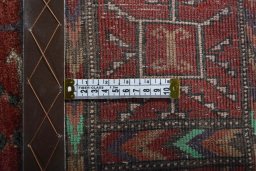 Close-up detail of 2000s Baloch rug from Iran / Persia showing Wool weave