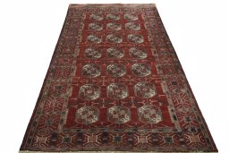 Surface texture of 2000s Baloch rug with natural Wool and intricate pattern