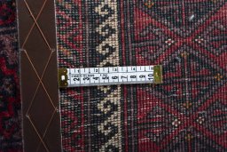 Close-up detail of 2000s Baloch rug from Iran / Persia showing Wool weave