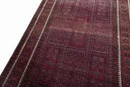 Backside of handmade 2000s Baloch rug showing knot structure and weave density