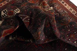 Corner detail of 2000s Baloch rug showing border pattern and Wool pile