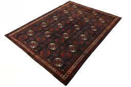 Corner detail of 2000s Baloch rug showing border pattern and Wool pile