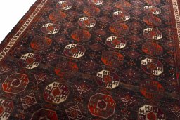 Backside of handmade 2000s Baloch rug showing knot structure and weave density