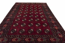 Surface texture of 2000s Baloch rug with natural Wool and intricate pattern