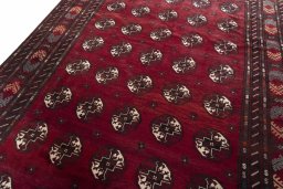 Backside of handmade 2000s Baloch rug showing knot structure and weave density