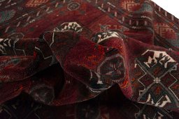 Corner detail of 2000s Baloch rug showing border pattern and Wool pile