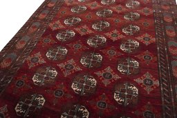 Backside of handmade 2000s Baloch rug showing knot structure and weave density