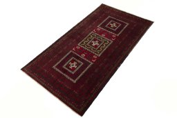 Corner detail of 2000s Baloch rug showing border pattern and Wool pile