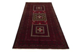 Surface texture of 2000s Baloch rug with natural Wool and intricate pattern