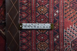 Close-up detail of 2000s Baloch rug from Iran / Persia showing Wool weave