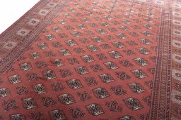 Backside of handmade 2000s Baloch rug showing knot structure and weave density