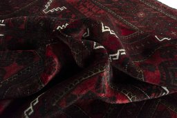 Corner detail of 2000s Baloch rug showing border pattern and Wool pile