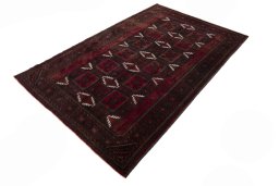 Corner detail of 2000s Baloch rug showing border pattern and Wool pile