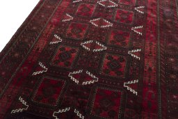 Backside of handmade 2000s Baloch rug showing knot structure and weave density