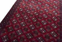 Backside of handmade 2000s Baloch rug showing knot structure and weave density