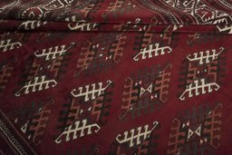 Full view of 1970s Baloch rug from Iran / Persia, 345 × 240 cm in Red tones