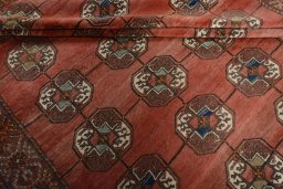 Corner detail of 1970s Baloch rug showing border pattern and Wool pile