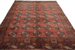 Surface texture of 1970s Baloch rug with natural Wool and intricate pattern