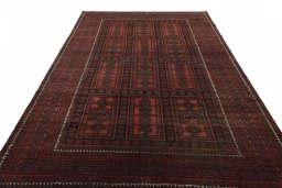 Surface texture of 2000s Baloch rug with natural Wool and intricate pattern
