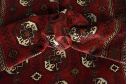 Corner detail of 2000s Baloch rug showing border pattern and Wool pile
