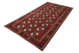 Corner detail of 2000s Baloch rug showing border pattern and Wool pile