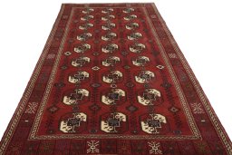 Surface texture of 2000s Baloch rug with natural Wool and intricate pattern