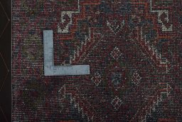 Corner detail of 2000s Baloch rug showing border pattern and Wool pile