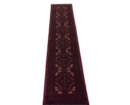 Surface texture of 2000s Baloch rug with natural Wool and intricate pattern