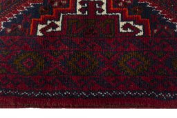 Close-up detail of 2000s Baloch rug from Iran / Persia showing Wool weave