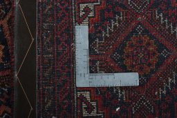 Close-up detail of 2000s Baloch rug from Iran / Persia showing Wool weave