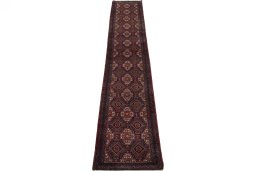 Surface texture of 2000s Baloch rug with natural Wool and intricate pattern