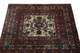 Surface texture of 2000s Baloch rug with natural Wool and intricate pattern
