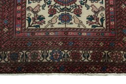 Backside of handmade 2000s Baloch rug showing knot structure and weave density