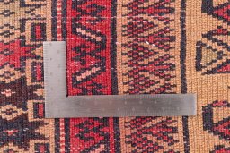 Corner detail of 1970s Baloch rug showing border pattern and Wool pile