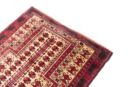 Surface texture of 1970s Baloch rug with natural Wool and intricate pattern