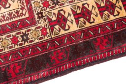 Backside of handmade 1970s Baloch rug showing knot structure and weave density