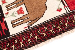 Backside of handmade 1970s Baloch rug showing knot structure and weave density