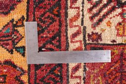 Corner detail of 1987s Baloch rug showing border pattern and Wool pile